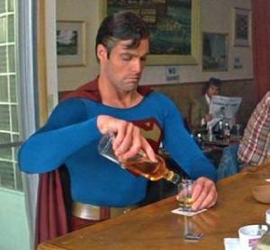 Superman getting drunk in a bar
